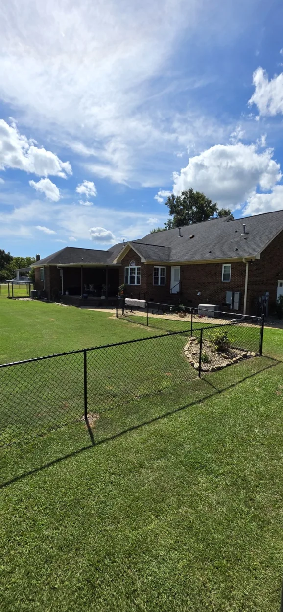 Black chain-link residential fence